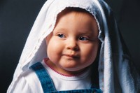 Baby with a towel on his/her head