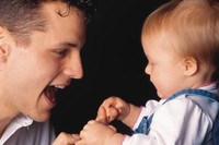 Dad talking to baby